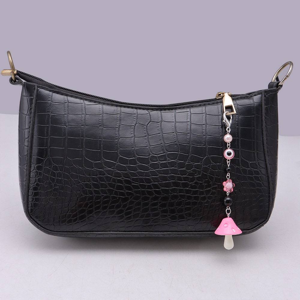 La versión coreana transfronteriza de la joyería de llavero de setas de color, la resina de dibujos animados, el ojo creativo del diablo, el bolso, el colgante de accesorios