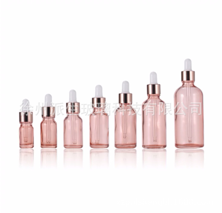 Venta al por mayor 10ml melocotón transparente vidrio Rosa botella de aceite esencial 20ml cosmética sub-botella Rosa anillo de oro botella de vidrio