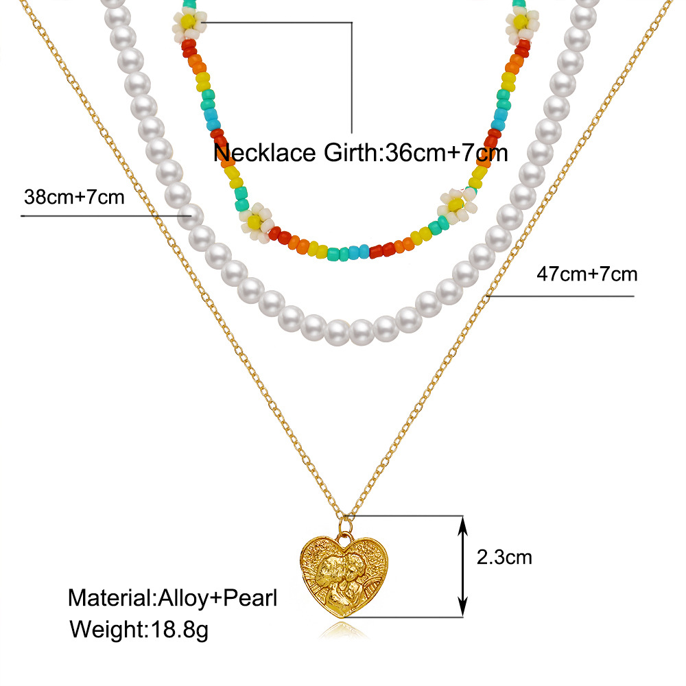 New Multi-layer Stacking Daisy Rice Beads Heart-shaped Embossed Pearl Necklace Wholesale display picture 1