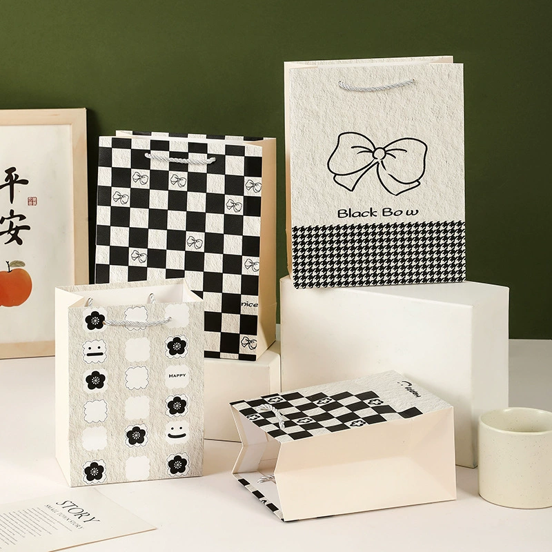 Новая тисненая серия изысканных подарочных пакетов ручной работы, креативный дизайн, горячая распродажа, прямые поставки с фабрики, оптом.