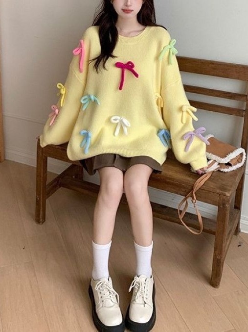 2023 suéter suelto de dopamina Otoño e Invierno chica dulce desgaste arco tridimensional diseño nicho reducción de la edad de punto top