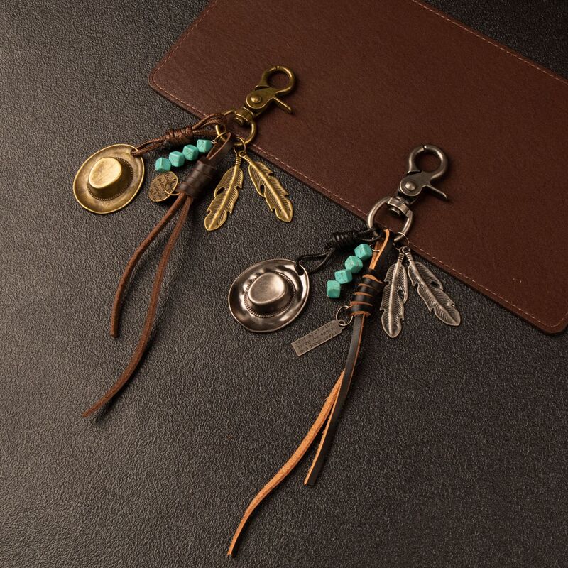 Western-style cowboy hat feather leather keychain, vintage distressed alloy pendant, bohemian bag accessory