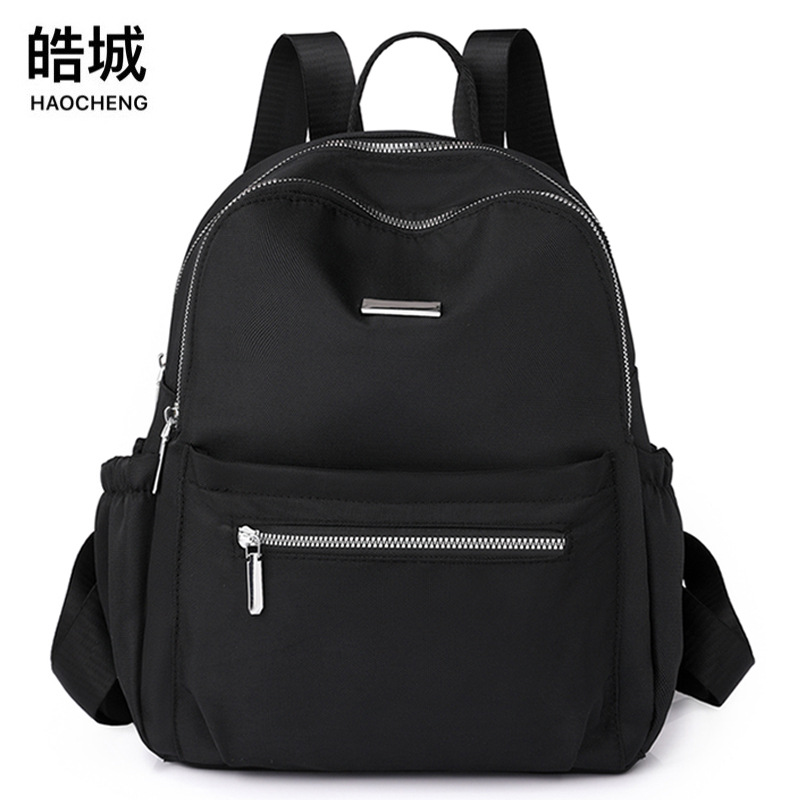 2023 otoño nuevo estilo casual damas mochila de nailon simple color sólido al aire libre mochila de viaje ligera mochila escolar