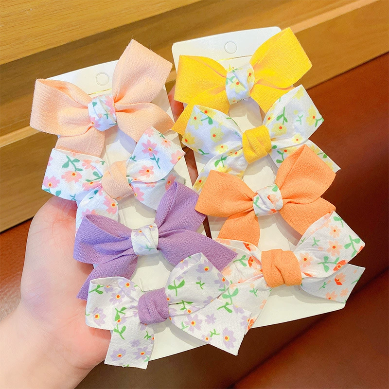 Cute children's universal hairgrip with bow, hair accessory, floral print