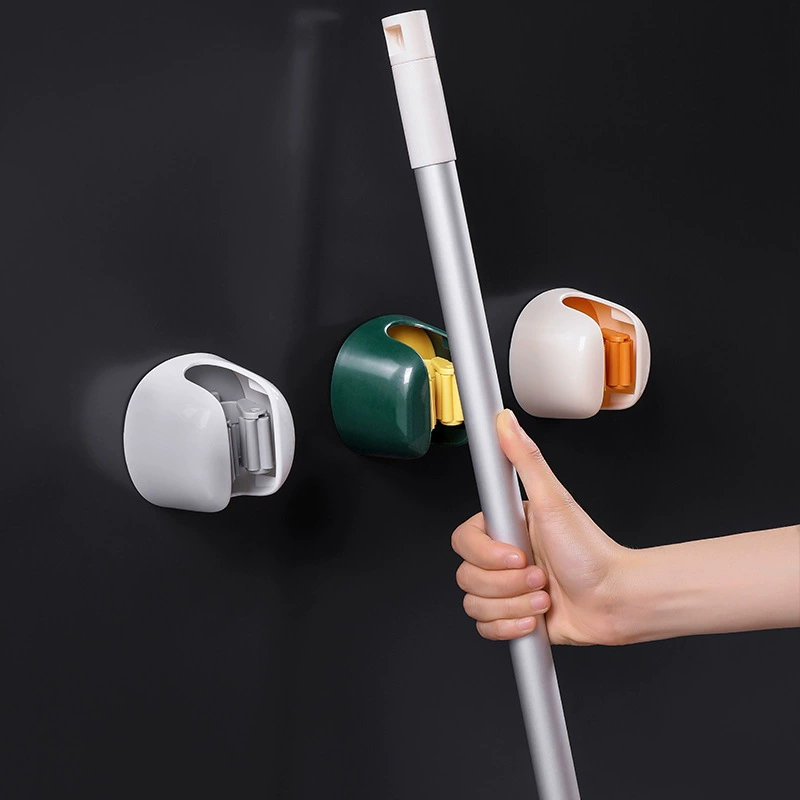 Холодильник? нет - переведём дословно: Nordic Punch-Free Mop Clip Wall Hanger - Snap Mop/Broom Storage Rack, Wall Mount, Green/Orange/Gray