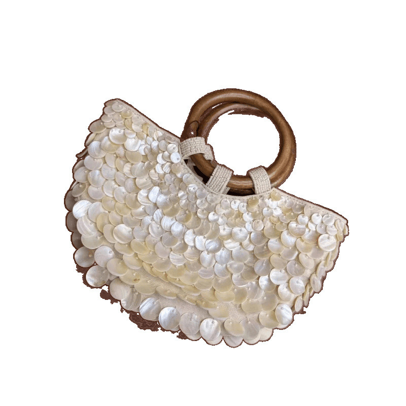 2025 primavera y verano nuevo estilo de alta sensación pura mano natural conchas bolsas de hadas bolsas portátiles bolsas de mujer pequeñas tendencia de personalidad crowdsourcing