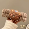 Brown bear hairband/flat car interface