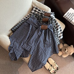 レトロな学院風の不規則な格子縞のスカートの女性服の夏の新型のデザイン感の小さい大衆はa字のスカートを縛ります。