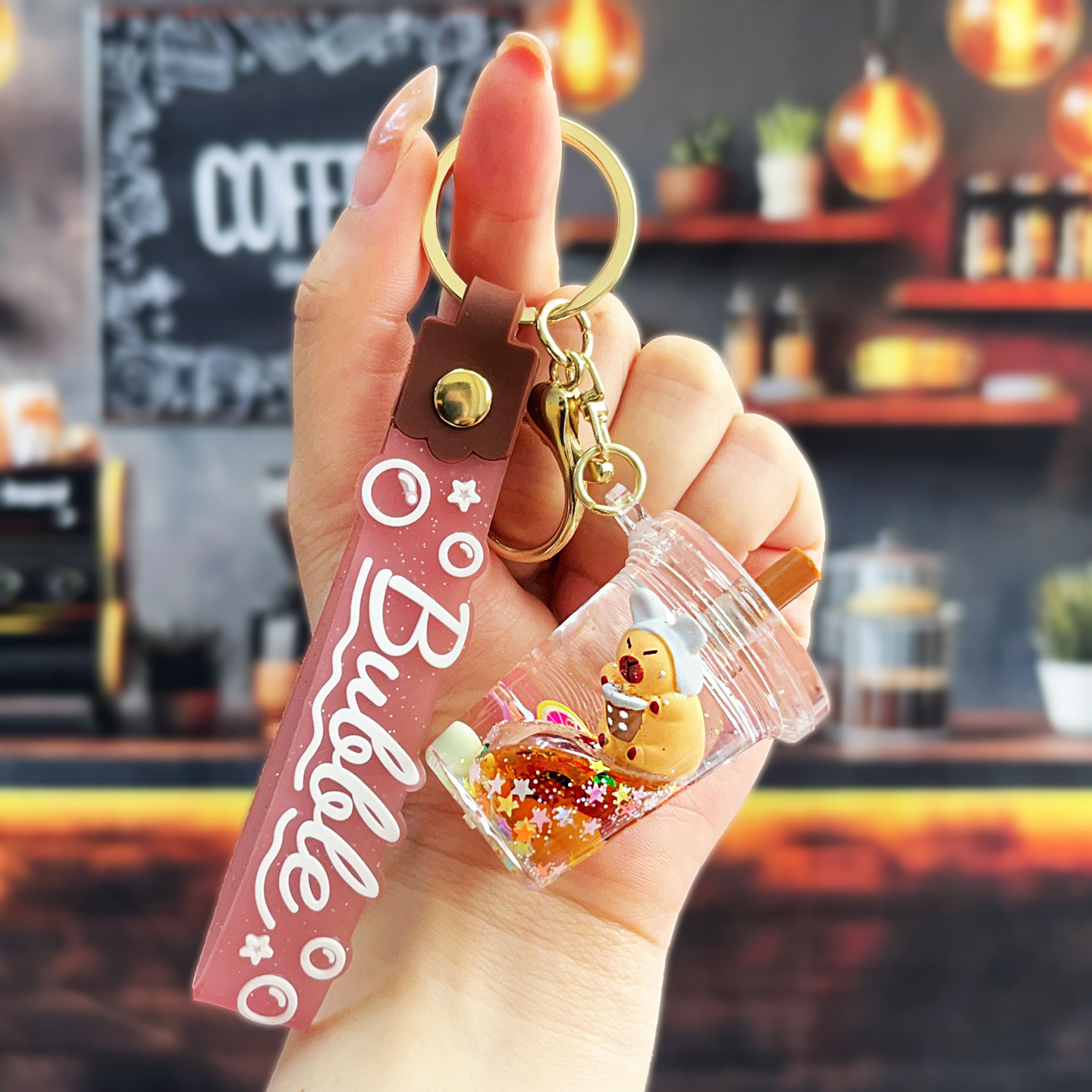 Nuevo aceitoso arena movediza taza de té con leche llavero colgante lindo divertido Kapibala llavero flotante pequeño regalo al por mayor
