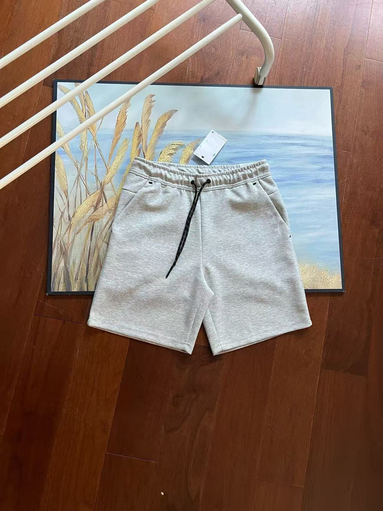 Verano nuevo estilo pequeño gancho versión en el extranjero de doce colores pantalones cortos deportivos de punto de pegamento lateral para hombres pantalones de cinco puntos 4503