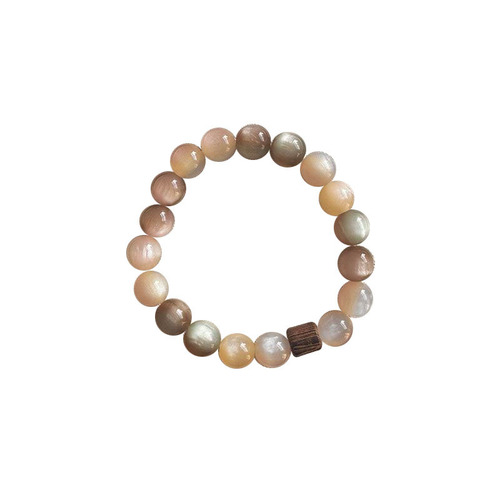 Sustainable-style, visually stunning Instagram-worthy, niche women's bracelet with a 2025 vintage pink-brown charm.