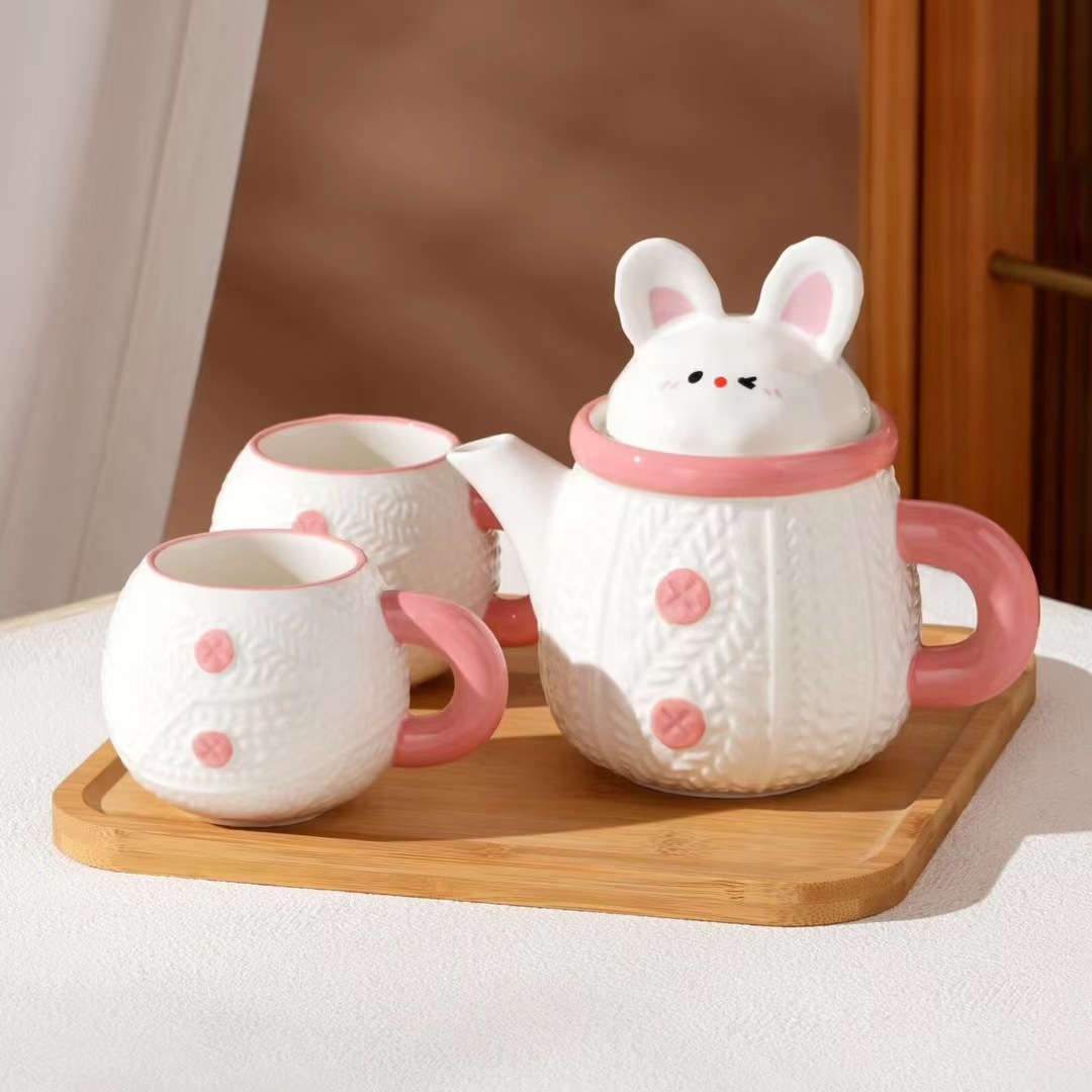Creativo y lindo conejo hervidor de cerámica taza de agua doméstica de alto valor de cara con regalo de mano para niñas con un conjunto de tazas de agua