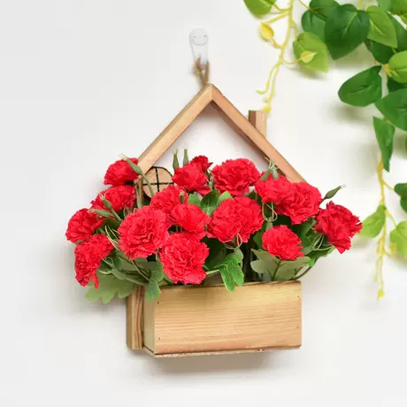 Wooden house + red carnation