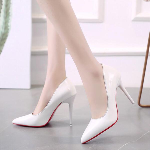 Elegant fashionable high heels nude made of patent leather…