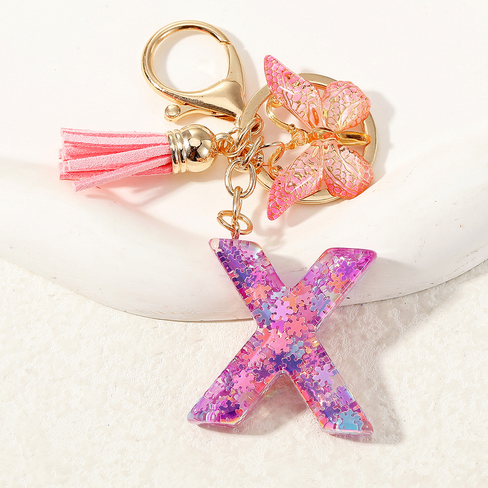 Nuevo color púrpura claro mezcla de polvo brillante letras inglesas resina llave colgante estilo simple mariposa borda colgante