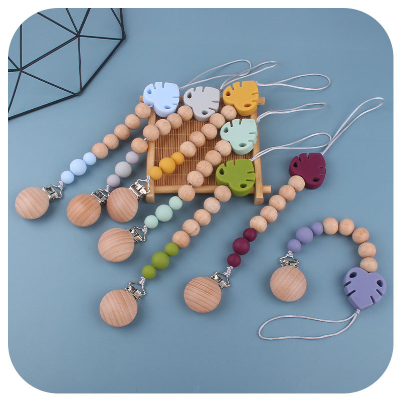 Suministros para bebés creativo haya chupete clip molar juguete mordedor bebé hoja de silicona chupete cadena anti-caída de la cadena