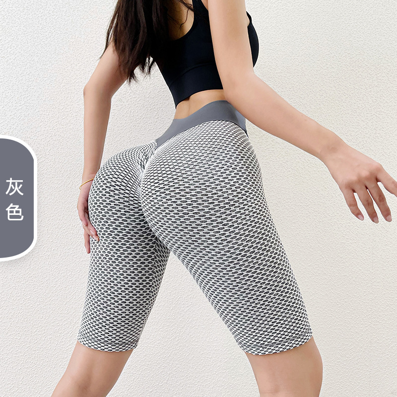 Panal europeo y americano sin costuras melocotón cadera pantalones de yoga de cinco puntos cintura alta estiramiento cadera medias deportivas Levantamiento de cadera pantalones de fitness