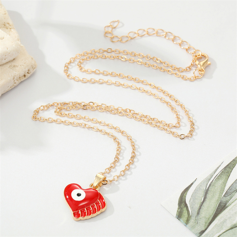Fashion Alloy Drip Oil Color Eyes Wings Heart Necklace Peach Heart Devil Eye Necklace display picture 2