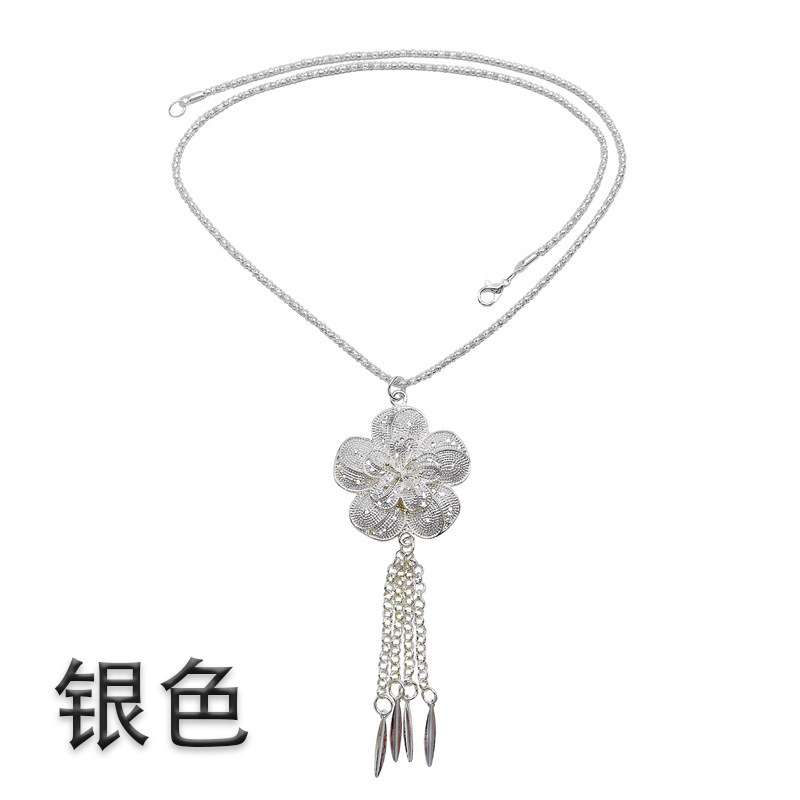 雲南タイ族のアクセサリーの民族風の金色のフリンジペンダントのアクセサリーの西双版納の金属は腰のチェーンにぶら下がっています。|undefined