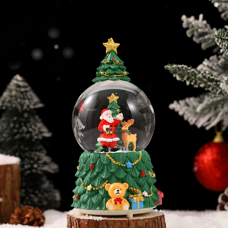 Una variedad de regalos de decoración de Navidad Navidad iluminante bola de cristal caja de música ventana diseño de velas lámparas de viento árbol de Navidad