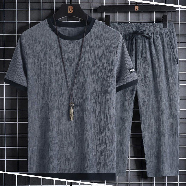 Un juego completo de camisetas de manga corta para hombres de verano relajado deportivo casual, pantalones cortos de siete puntos, dos conjuntos