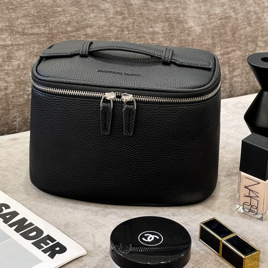 Nueva bolsa de maquillaje litchi mujer portátil de gran capacidad 2025 nueva sensación de alta calidad de viaje portátil bolsa de almacenamiento impermeable