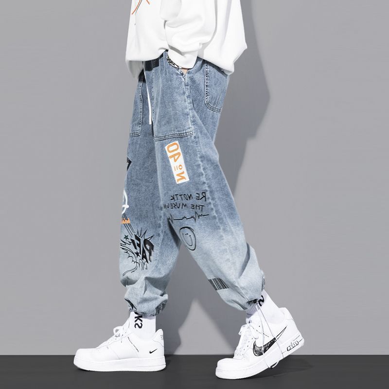 Jeans marca de moda para hombres rap hip hop Pantalones rectos de pierna ancha graffiti dibujos animados gradiente de moda suelta pantalones harén atados al tobillo
