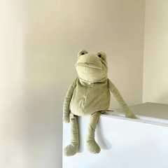 イギリスのファーガエルは柔らかいぬいぐるみの子供の付き添い人形のプレゼントをなだめます。