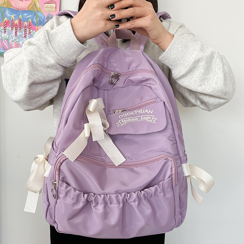 Nuevo anime japonés estilo universitario adorable arco de contraste de color plegado suave mochila de estudiantes mujeres