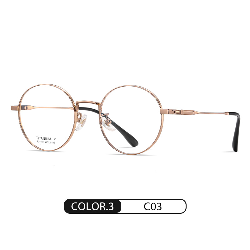 El nuevo marco de gafas de titanio puro F31102 de moda para hombres y mujeres con el mismo estilo puede equiparse con gafas de miopía, espejo plano redondo galvanizado IP