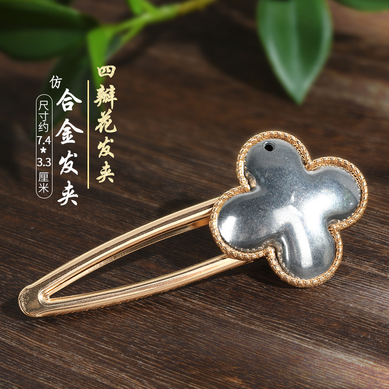 宋錦藍染刺繍部品のネジの下に髪を支えて布を包みます。|undefined