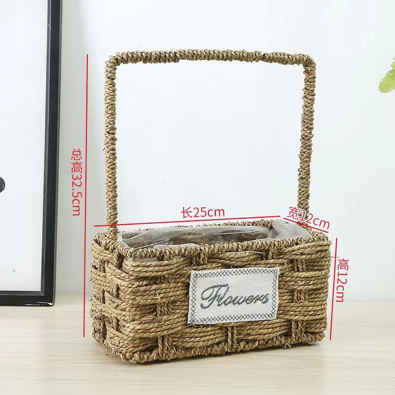Fabricantes de cestas de flores ovales rectas de paja hechas a mano en stock al por mayor cestas de flores de paja portátiles decoración de viento pastoral