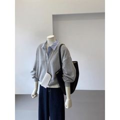 色にぶつかってpoloの襟の偽の2つの衛衣の女性の秋冬の新型のデザイン感の小さい大衆はゆったりしていてやせている独特な上着を現します。