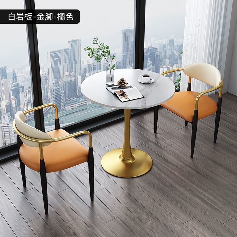 Gold legs + white rock slab + orange leather, one table and two chairs