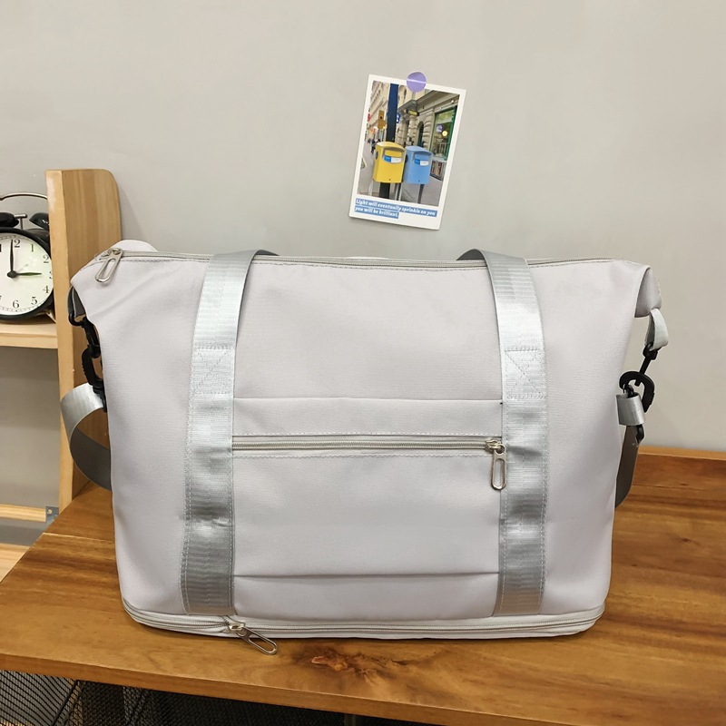 Comercio exterior al por mayor nueva bolsa de viaje de gran capacidad de separación seca y húmeda moda femenina color contraste viaje al aire libre almacenamiento bolsa de equipaje