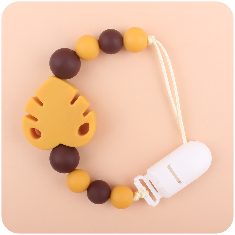 Suministros para bebés chupete cadena creativa bebé dibujos animados hojas silicona mordedura cadena anti-gota molar Nuevo