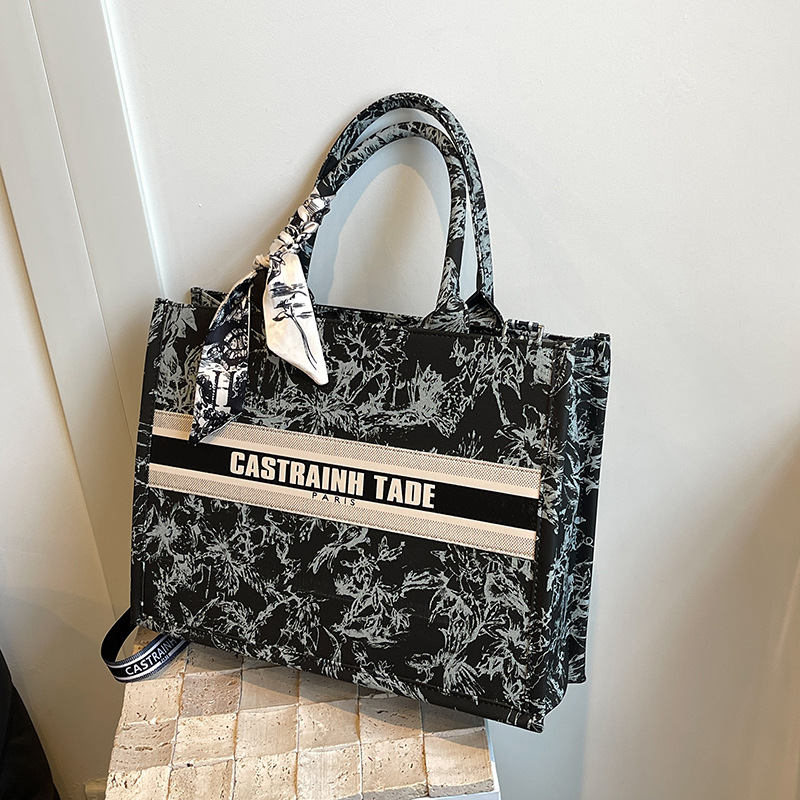 Bolsos de lona transfronterizos bolsos de mujer 2025 nueva moda retro letras impresas bolsos de hombro de gran capacidad