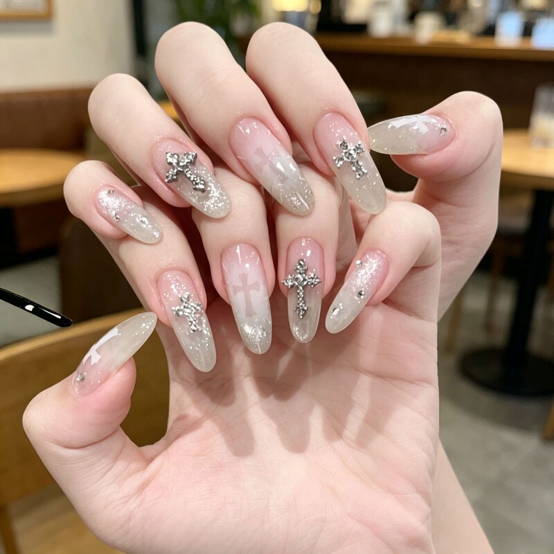 Nude-colored press-on nails with dazzling gradient and a high-end feel, featuring a cross design, suitable for a hot girl's light luxury, high-end handmade, and skin-brightening manicure Nude-colored press-on nails with dazzling gradient and a high-end feel, featuring a cross design, suitable for a hot girl's light luxury, high-end handmade, and skin-brightening manicure