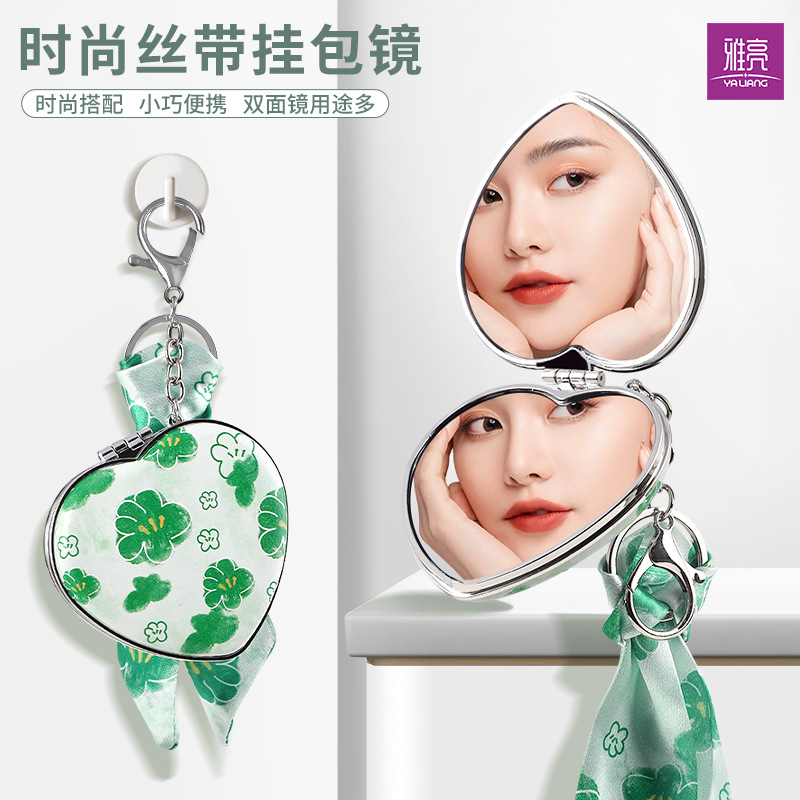 Espejo plegable con llavero en forma de corazón creativo Espejo pequeño portátil de doble cara de alto valor para la imagen Espejo de bolsa colgante de cinta personalizado