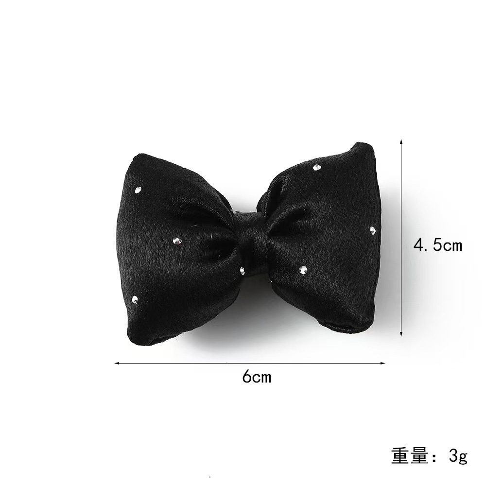 甘いミルクの昔の色のスポンジの蝶結びのヘアピンの少女の団子の頭のドリルの側は頭を挟んで飾ります。