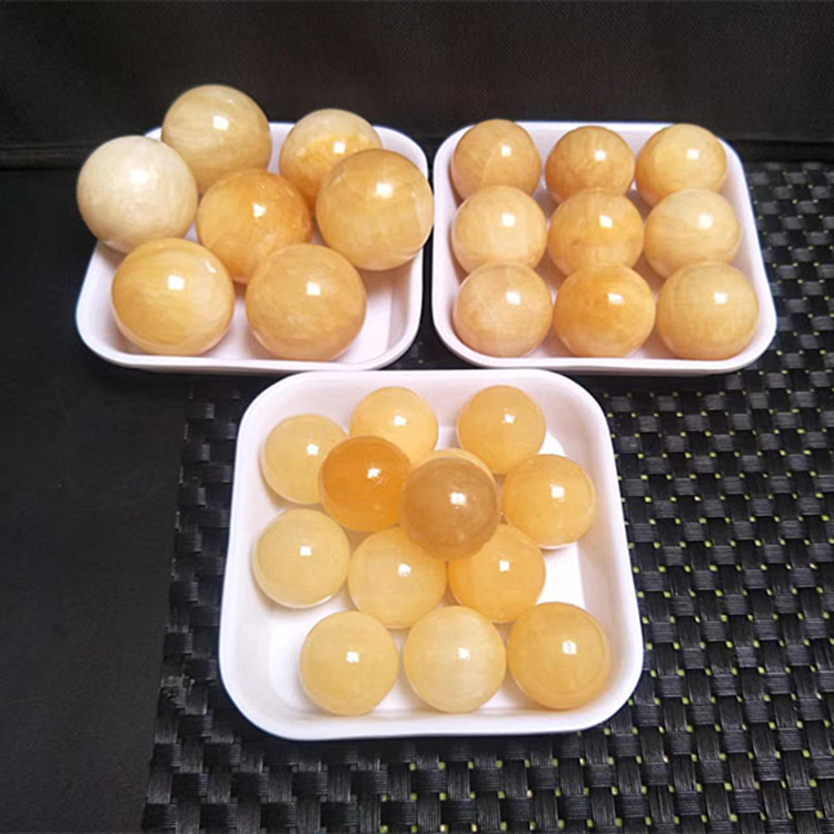 玉器玉石米黄玉手球出售 江湖地摊玉石小球风水球 电商直播玉饰品