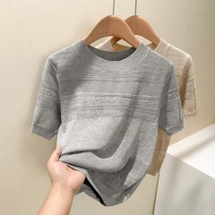 薄い氷の糸の透かし彫りのゆったりしたデザインのニットの女性2025夏の新型の天糸の丸首はやせている半袖のtシャツを現します。