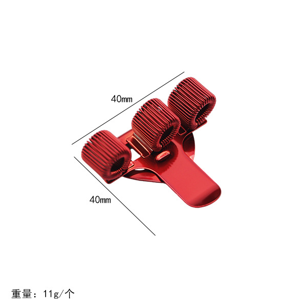 Red three-spring pen clip