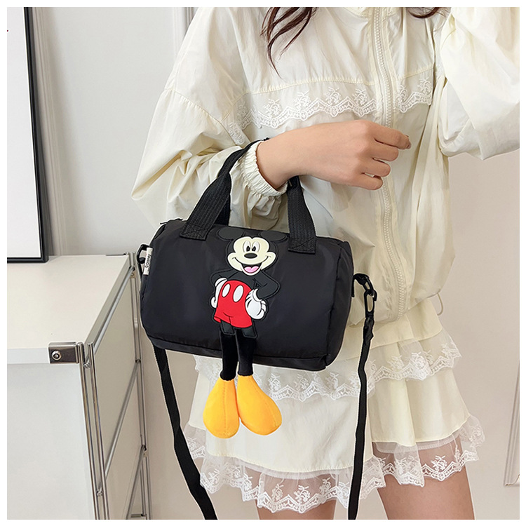The 2021 new children's bags feature a cute Mickey Mouse pattern bowling bag for girls and a fashionable hand-held shoulder bag undefined