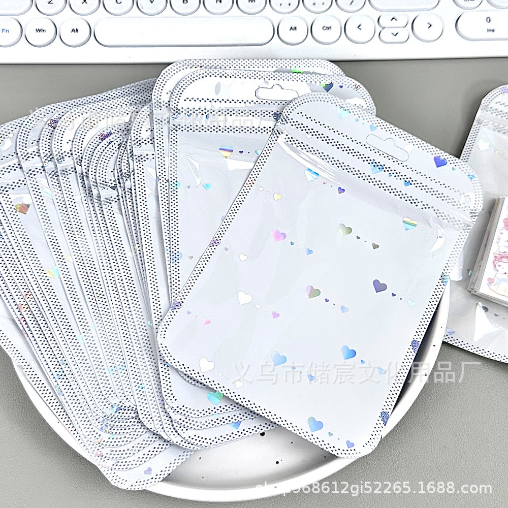 Bolsa autosellante de láser de amor de alta apariencia ins embalaje de tarjeta bolsa de regalo tarjeta pequeña mano cuenta Material embalaje bolsa de sellado