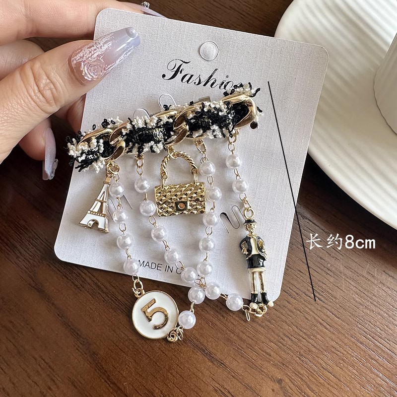 新型の美しいレトロな合金の潮の風はドリルのフリンジバッジの鉄塔の女性の優雅なブローチを入れてアクセサリーの卸売りを配合します。