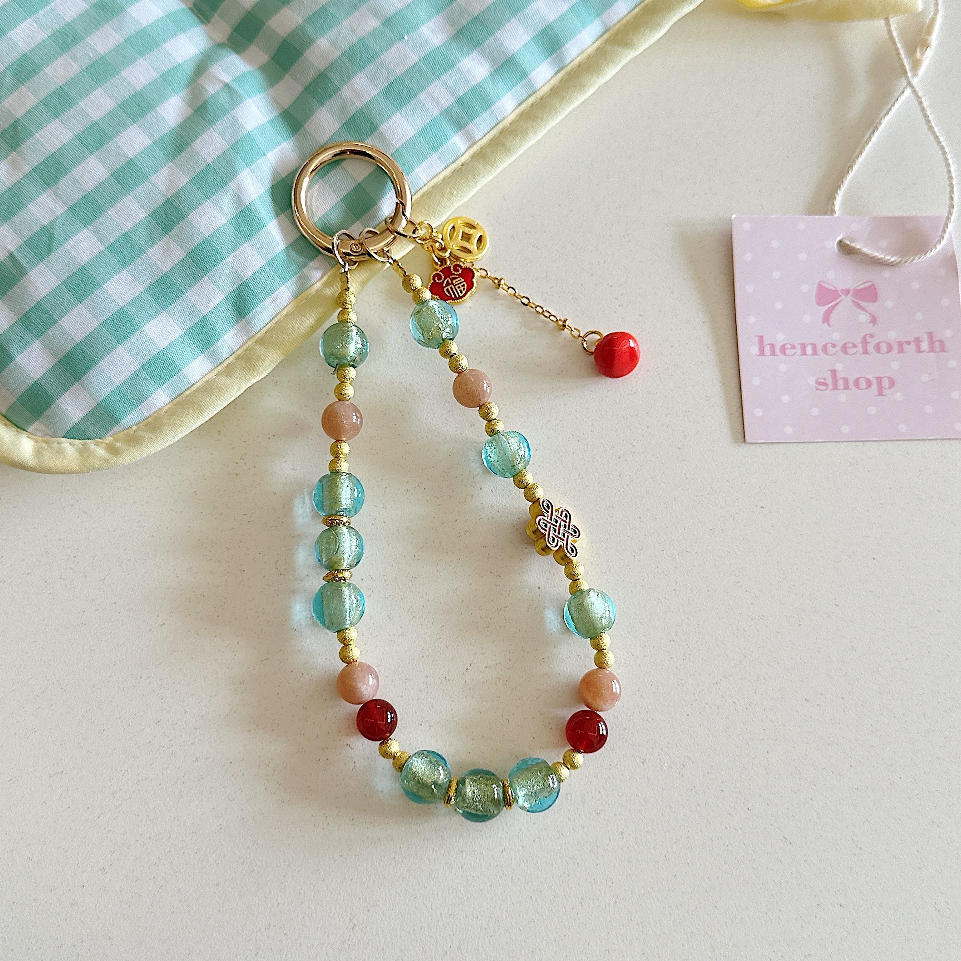 Boutique hecho a mano de alta gama cadena de teléfono móvil pulsera de caqui de vidrio de hoja de oro cordón de teléfono móvil de moda colgante de bolso corto