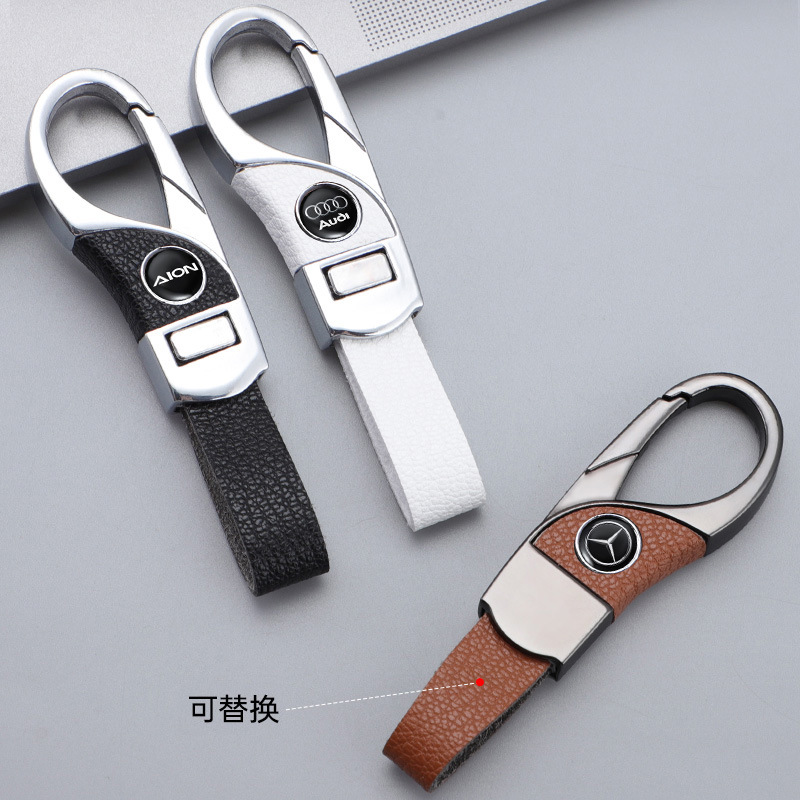 Llavero de automóvil transfronterizo, logotipo del automóvil, cientos de apellidos, botones de cuero de alta gama, colgante de llavero de negocios simple y personalizado