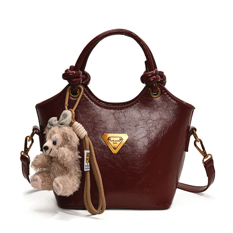 Bolsa de cubo de moda coreana retro primavera y verano nueva moda bolso de hombro de estilo de moda para trabajar textura personalidad mochila