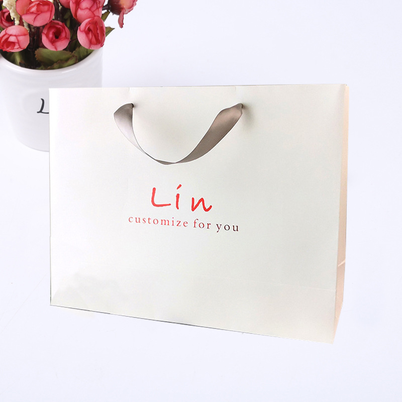 白卡纸手提袋设计制作服装店化妆品宣传手提纸袋子礼品包装纸袋